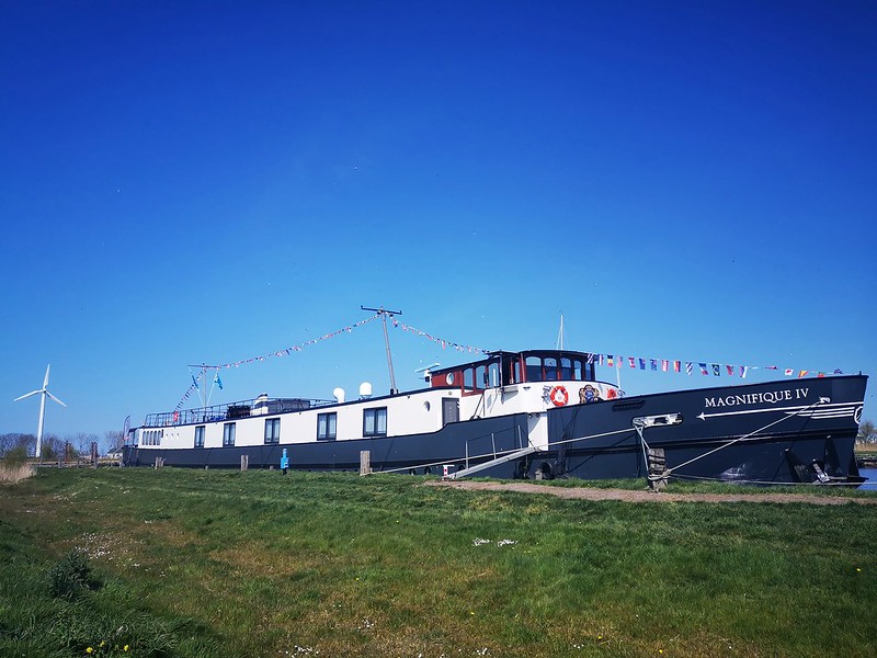 The Magnifique IV drifting down the water offers a luxurious way to travel and view the picturesque Dutch waterways.