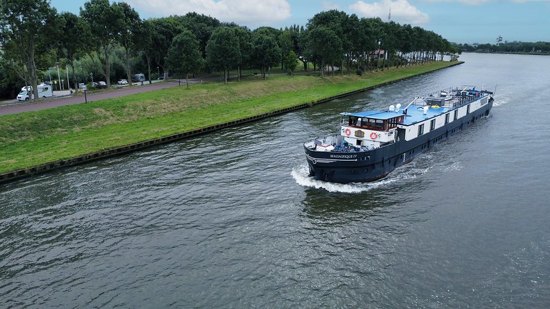 The Magnifique IV drifting down the water offers a luxurious way to travel and view the picturesque Dutch waterways.