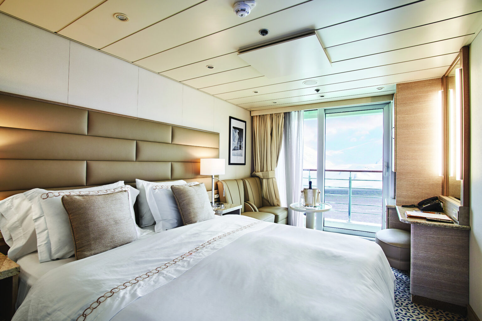 Explore the gardens of Scotland, Norway, and Orkney Islands with the American Horticultural Society aboard Exploris One. Each luxury room has comfortable beds and picturesque views.