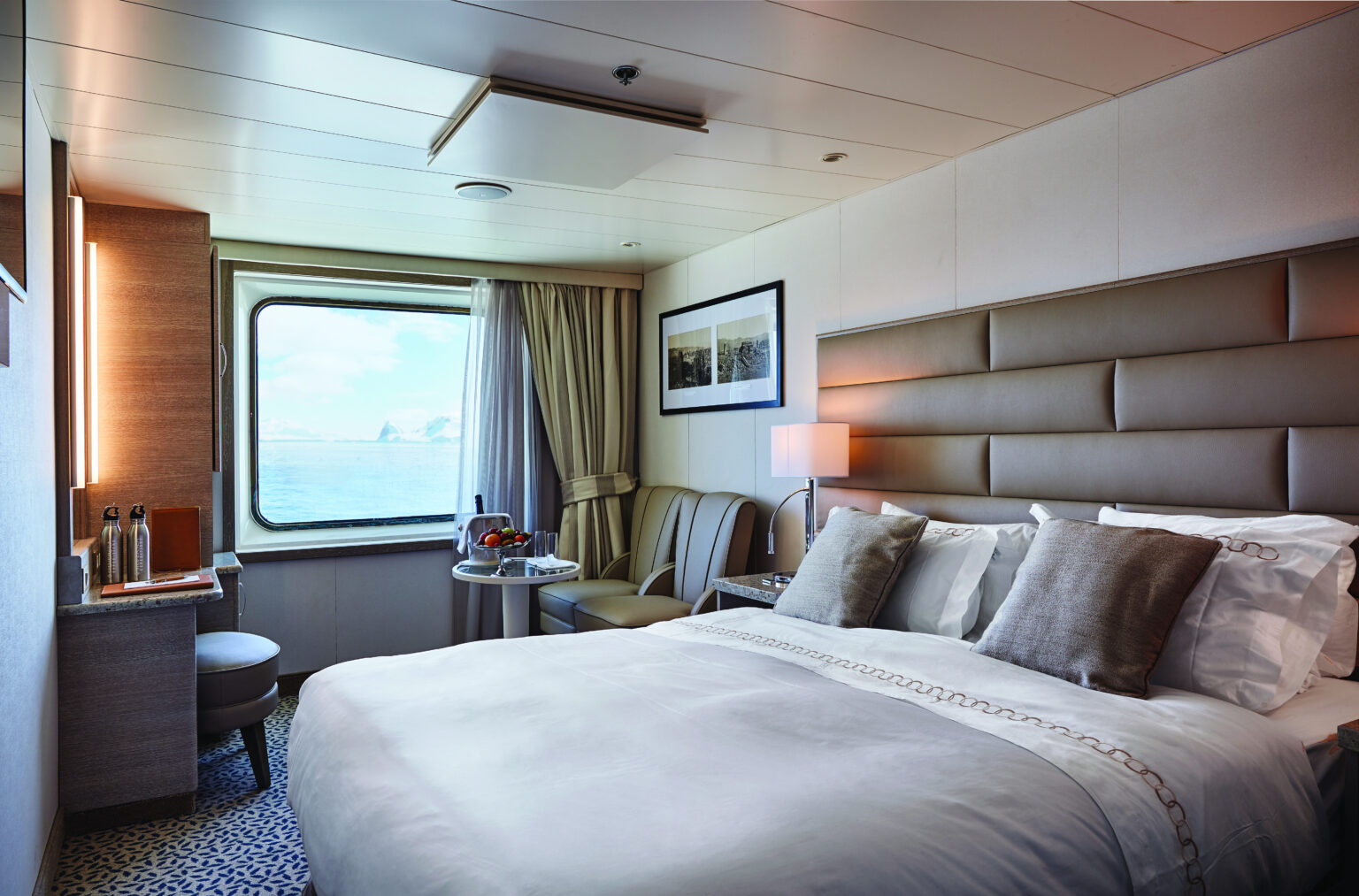 Explore the gardens of Scotland, Norway, and Orkney Islands with the American Horticultural Society aboard Exploris One. Each luxury room has comfortable beds and picturesque views.