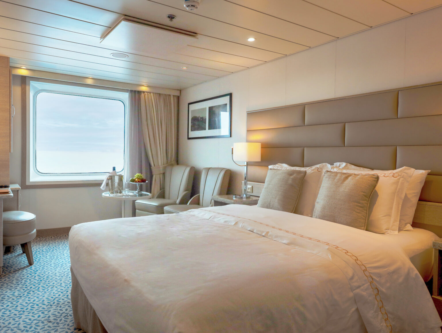 Explore the gardens of Scotland, Norway, and Orkney Islands with the American Horticultural Society aboard Exploris One. Each luxury room has comfortable beds and picturesque views.