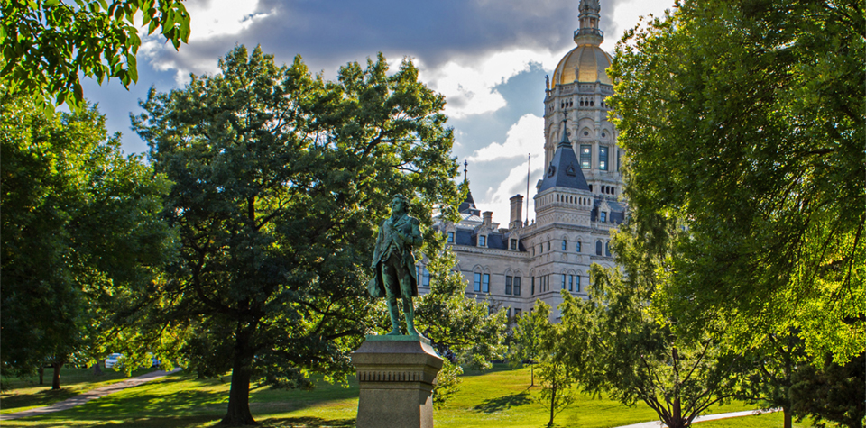 Overlooking Hartford's 41 acre Bushnell Memorial Park, the Connecticut State Capitol was constructed of New England marble and granite and crowned by a gold leaf dome.