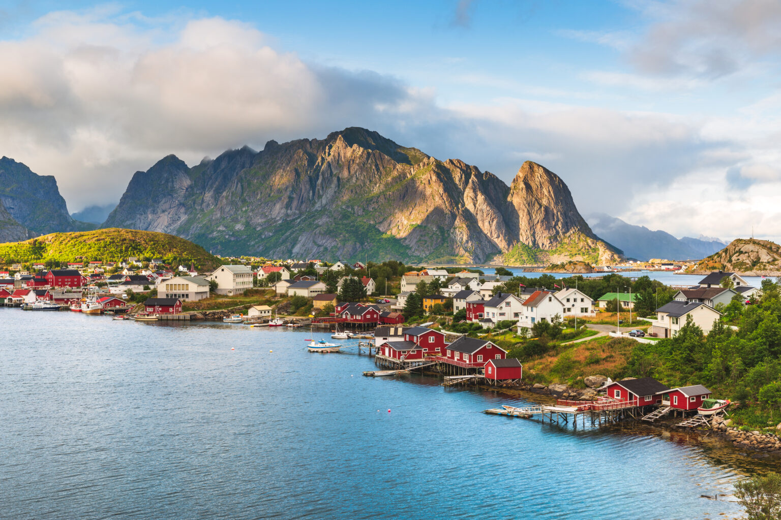 Reine, located in the Lofoten archipelago of Norway, is a picturesque fishing village renowned for its breathtaking landscapes and traditional red fishermen's cottages, known as rorbuer.