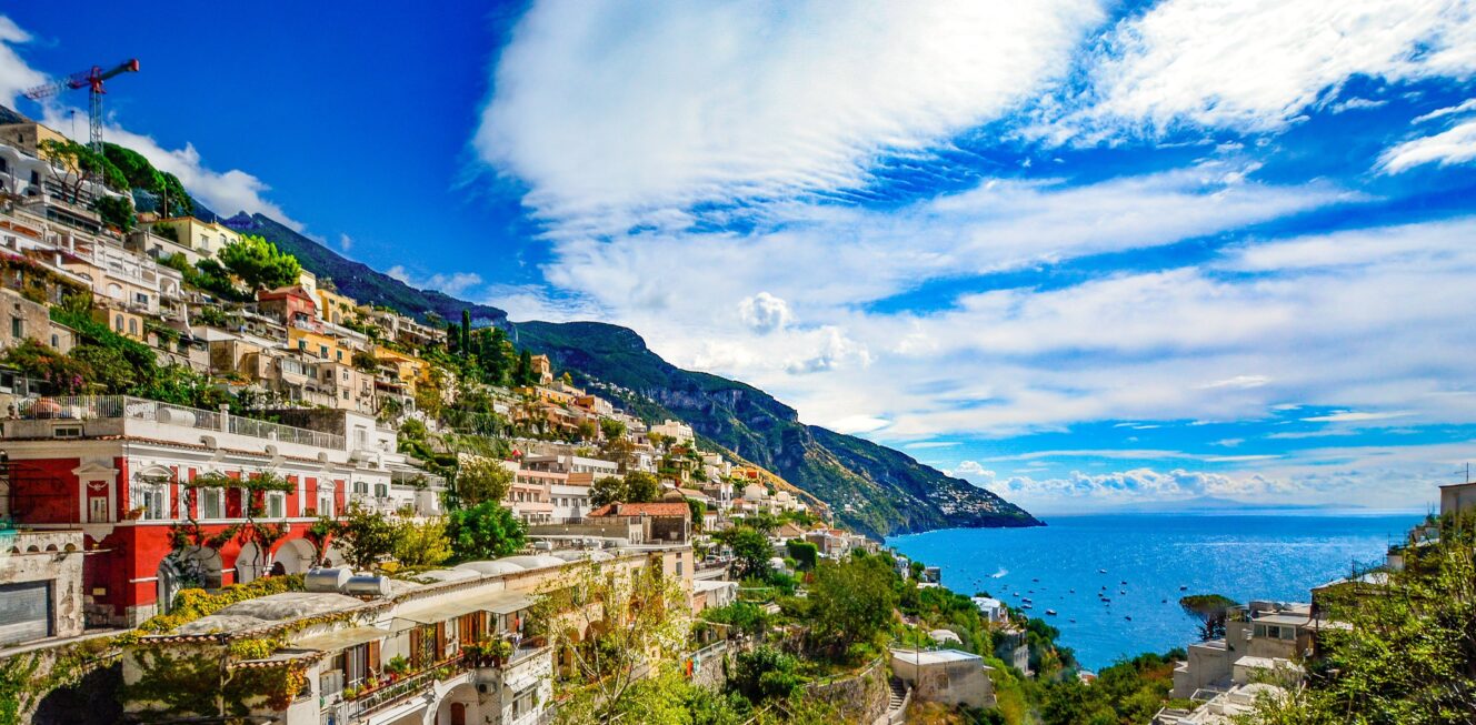 Positano village, a colorful hillside town on the Amalfi Coast, featuring steeply stacked buildings, vibrant Mediterranean architecture, and stunning sea views.