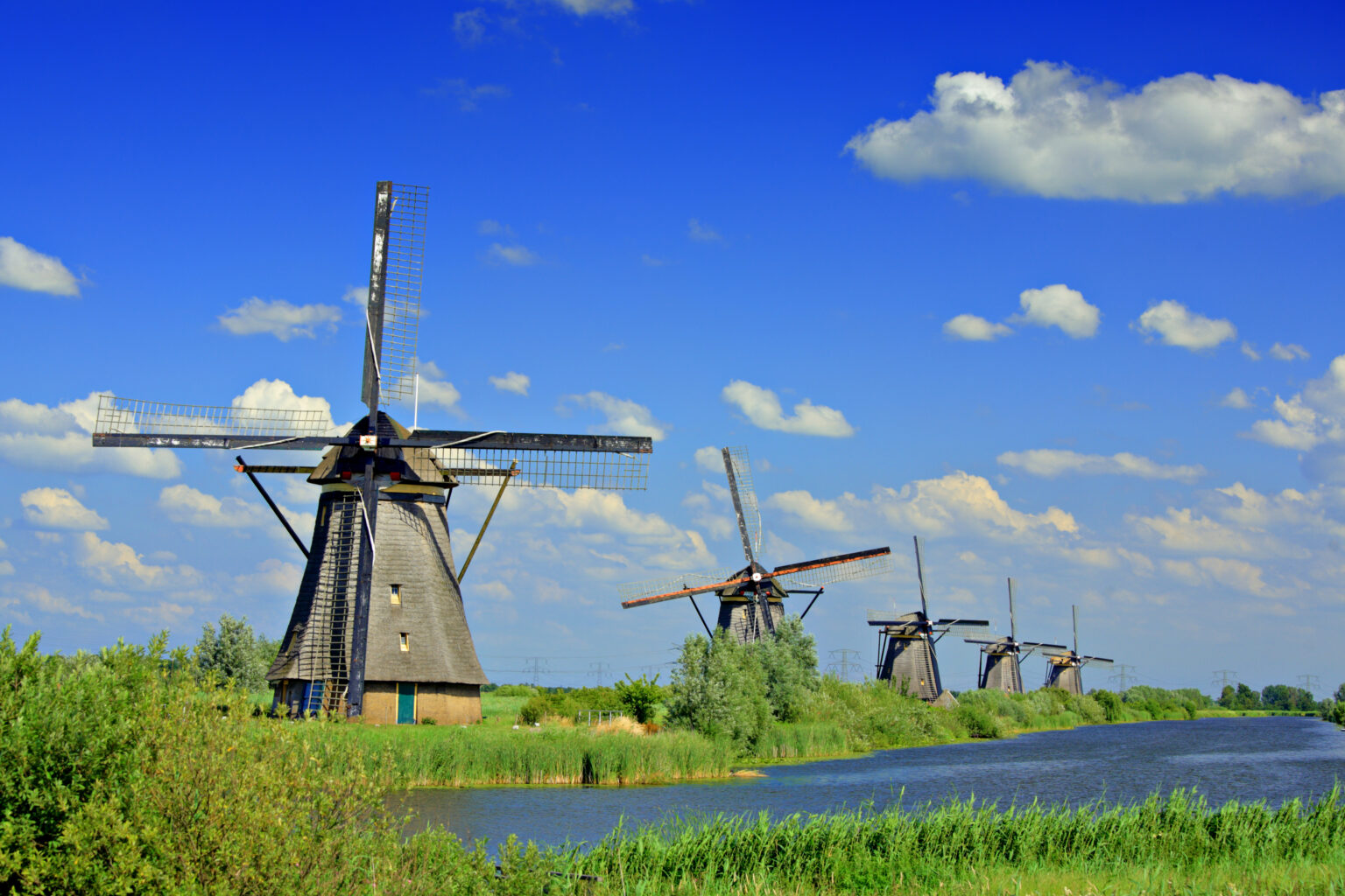 Windmills along the Dutch waterways, iconic symbols of the Netherlands, have been integral to the country's way of life for centuries.