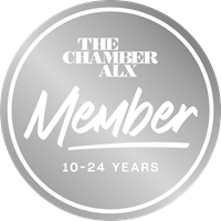 Round silver badge with white text: The CHamber ALX Member